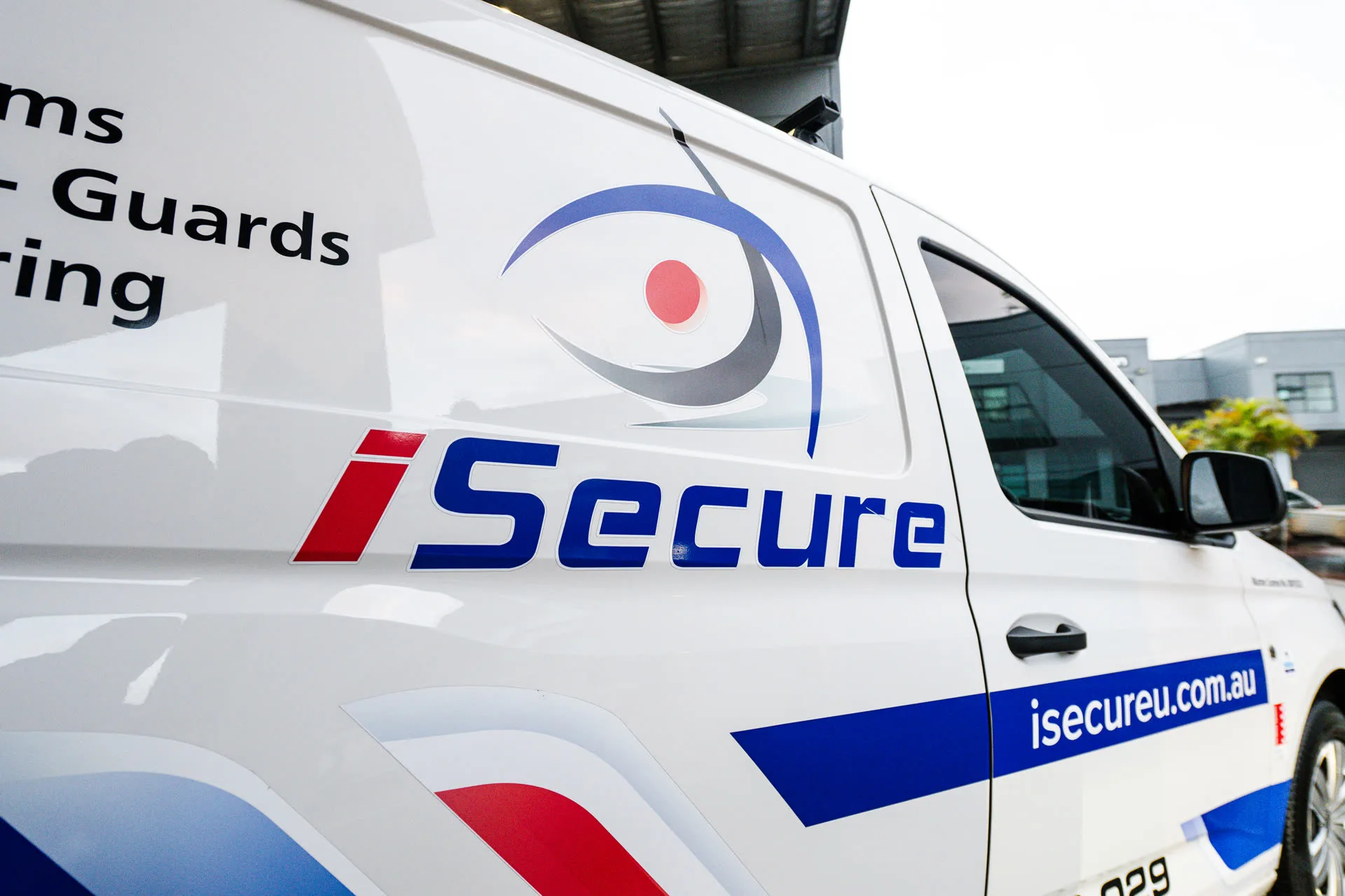 The iSecure eye logo on a fleet van