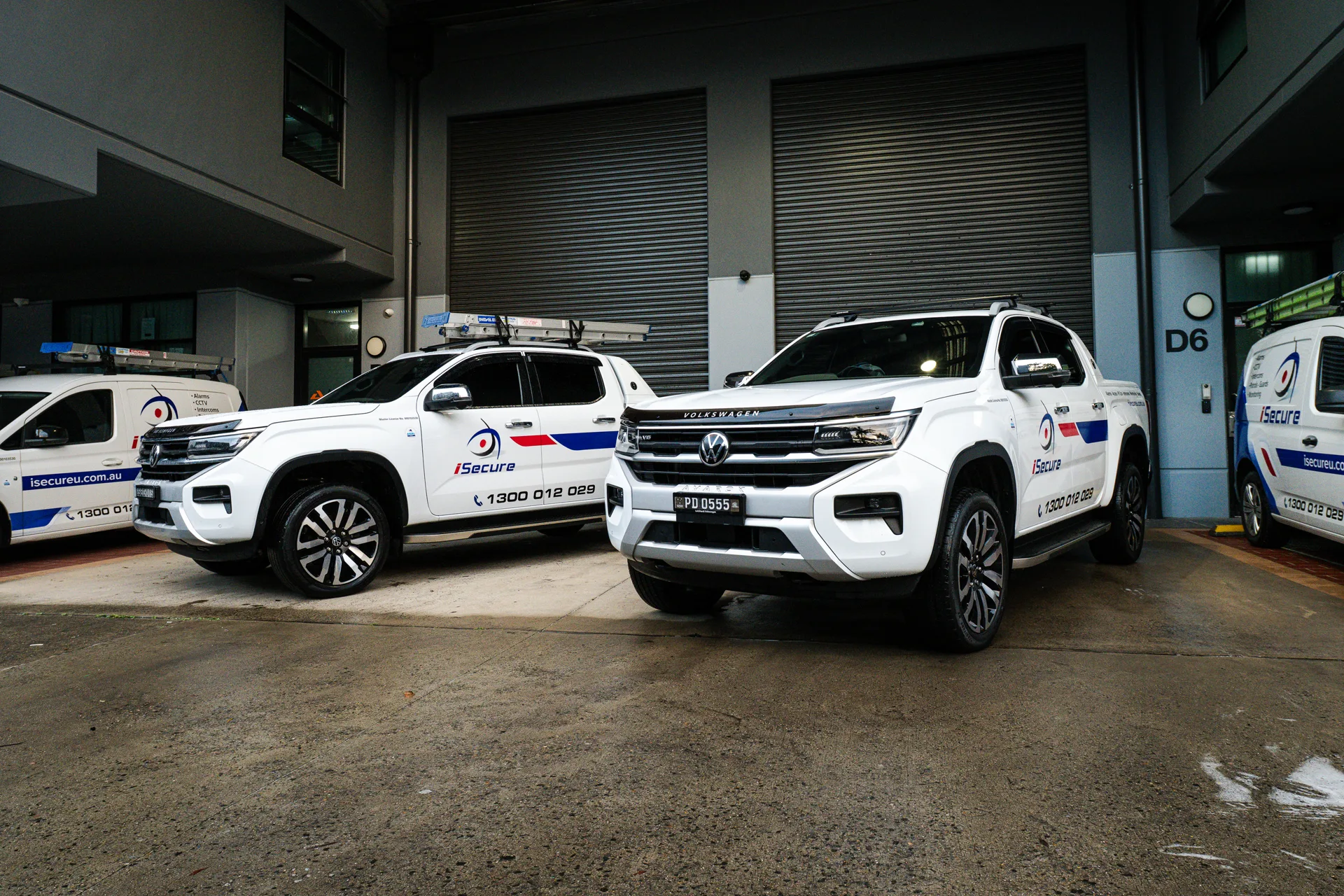 iSecure patrol vehicles parked at the depot at night
