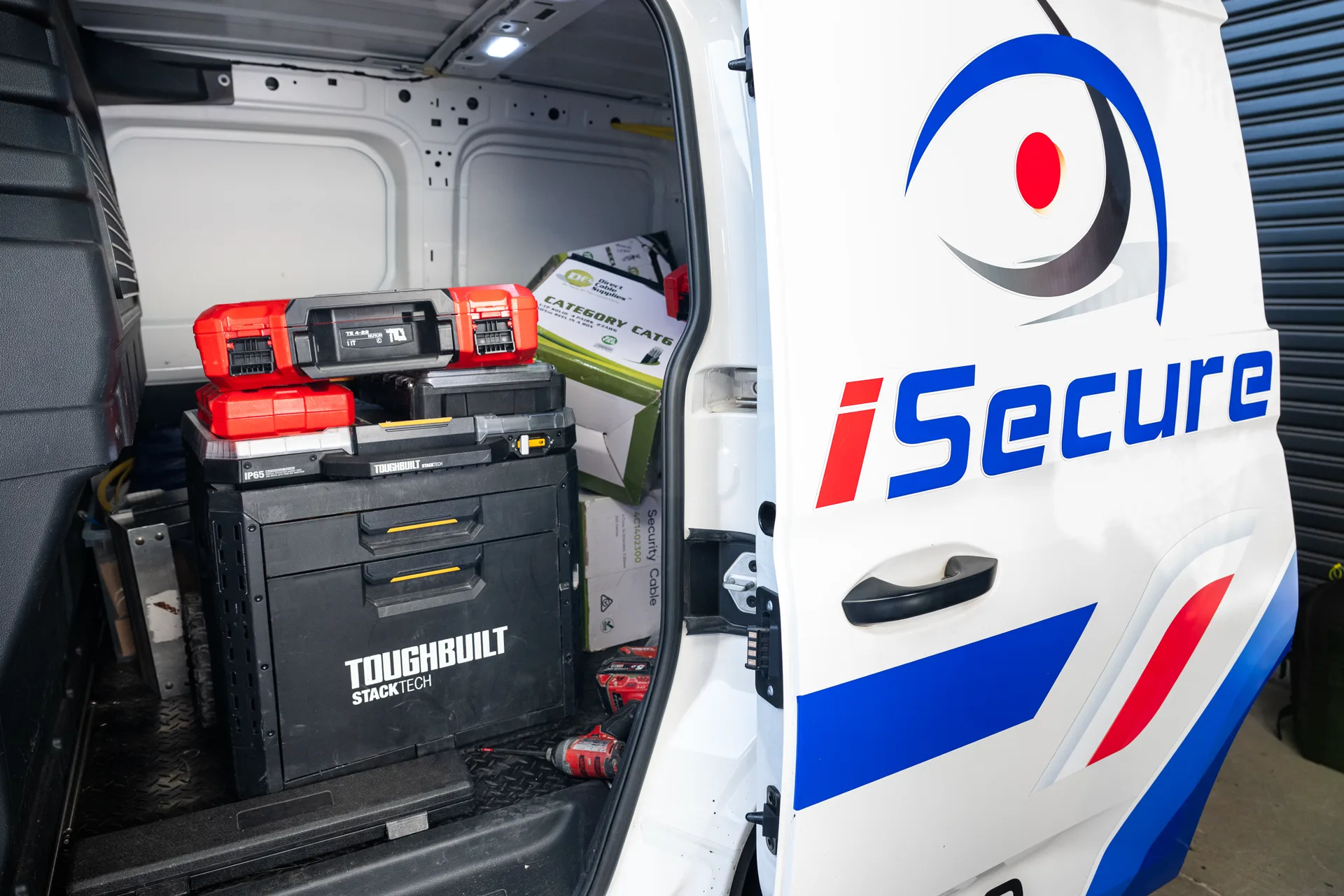 An iSecure van loaded with tools and cable ready for a job