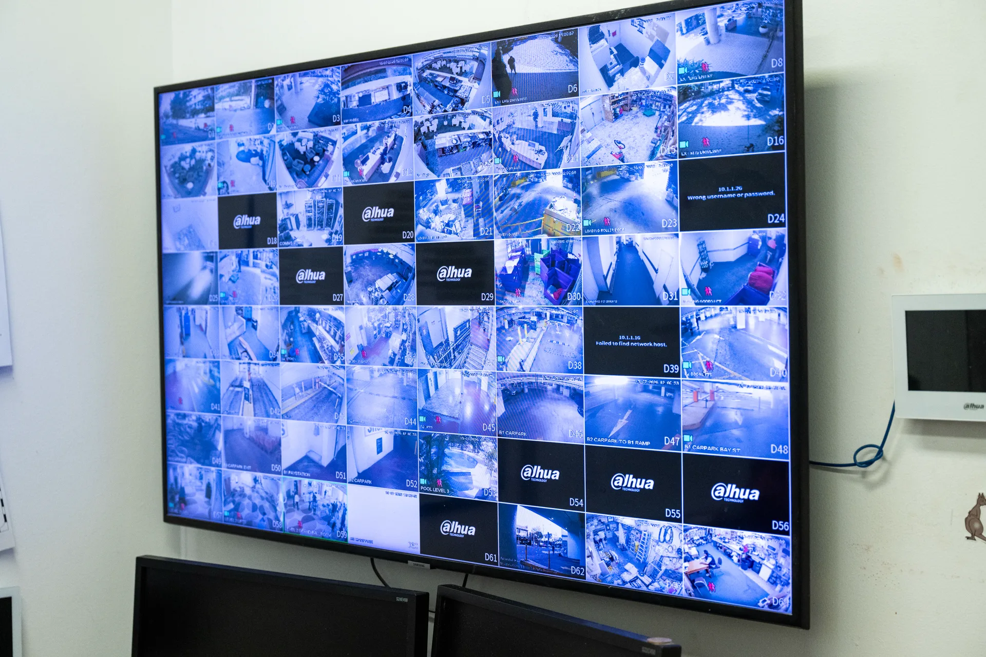 A wall screen showing sixty four live camera feeds
