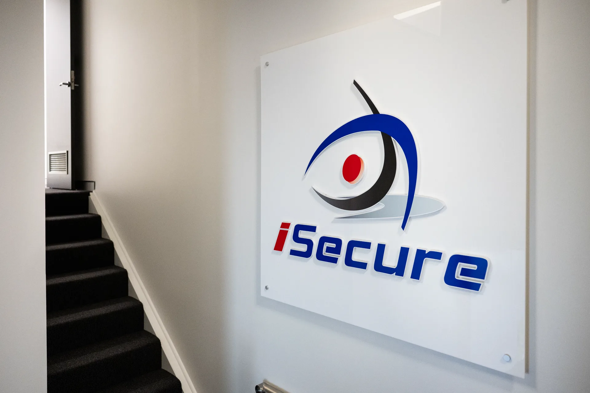 The iSecure sign on an office wall